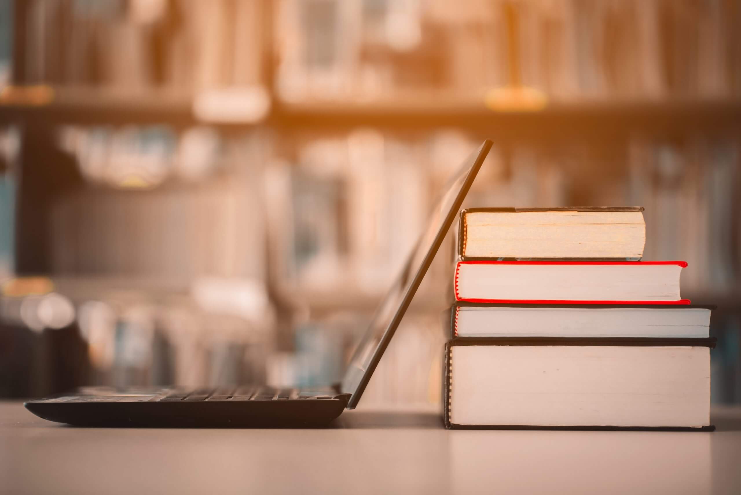 Stacked books and reference materials
