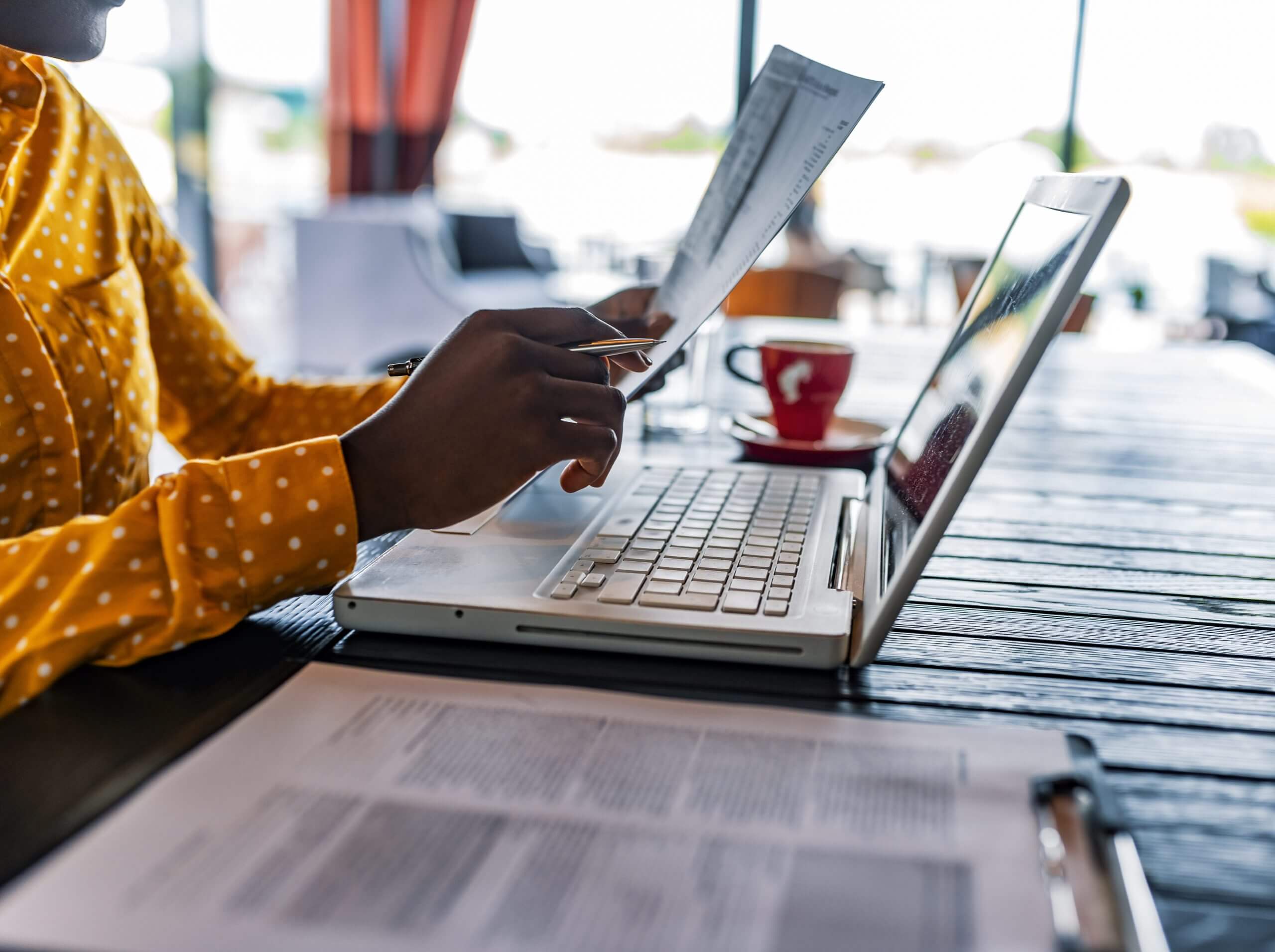Person completing a case survey on a laptop