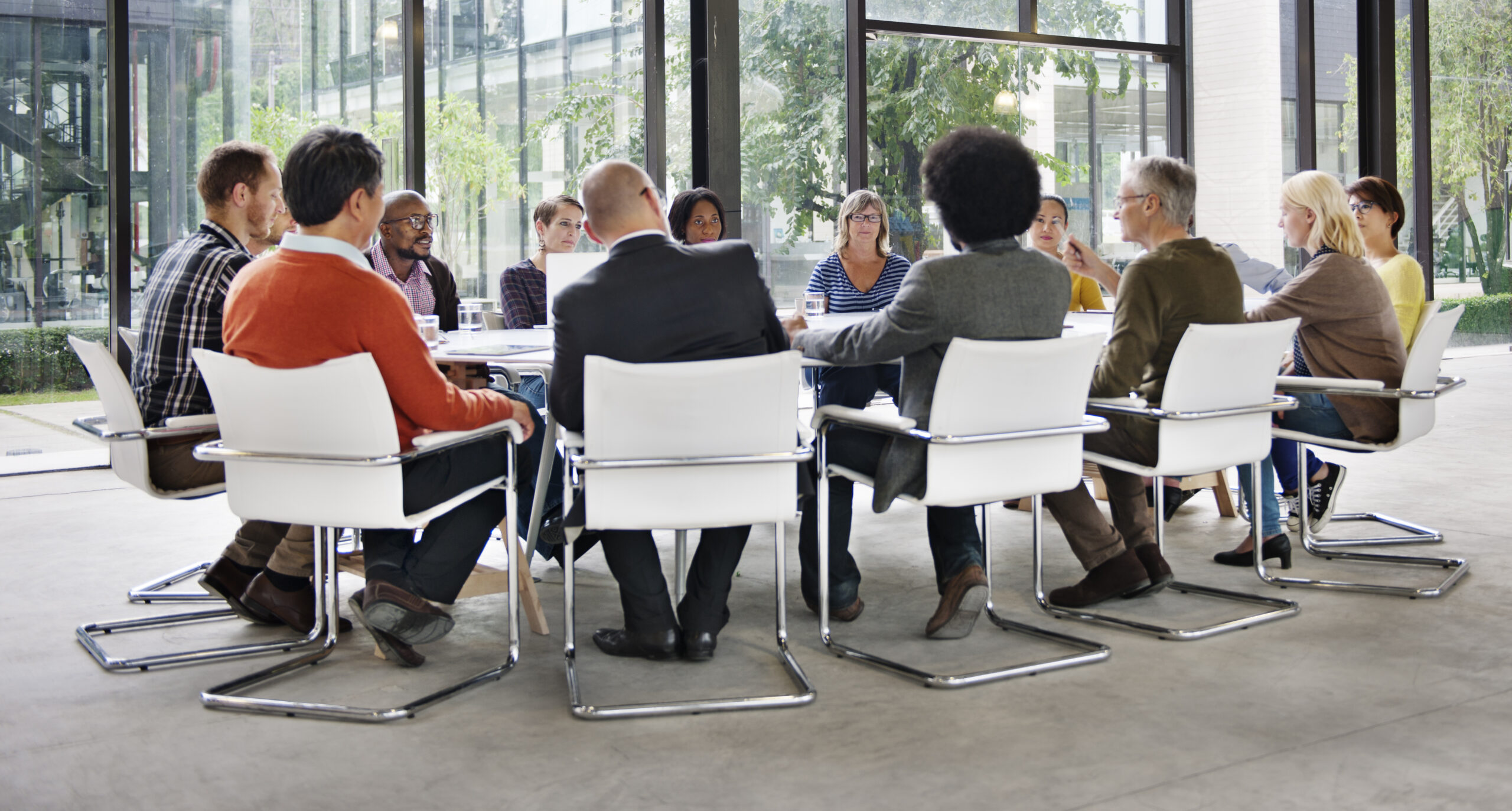 Research focus group in discussion around a conference table